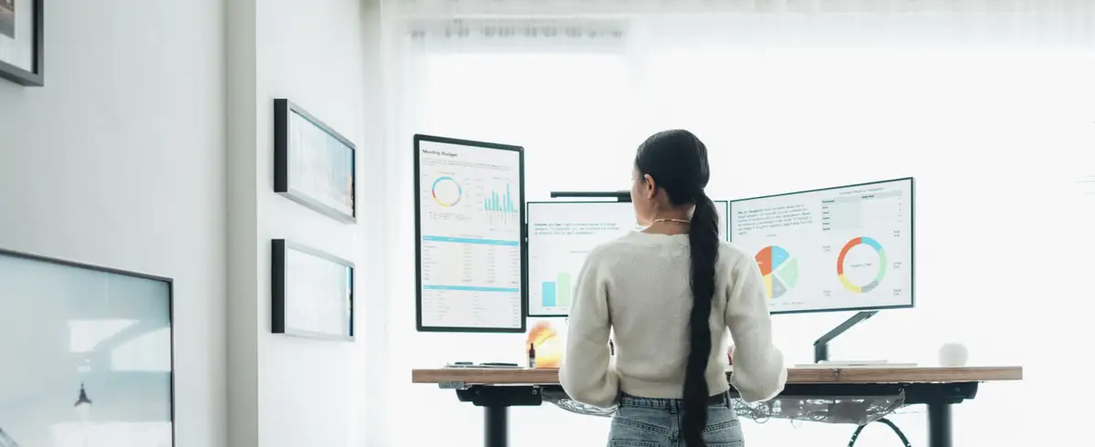 worker at standing desk in an office